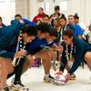 Members of the Samoan national rugby team demonstrate how the game is played to students at Roy Martin Middle School, Feb. 8, 2012. Members of the Samoan national rugby team demonstrate how the game is played to students at Roy Martin Middle School, Feb. 8, 2012.
